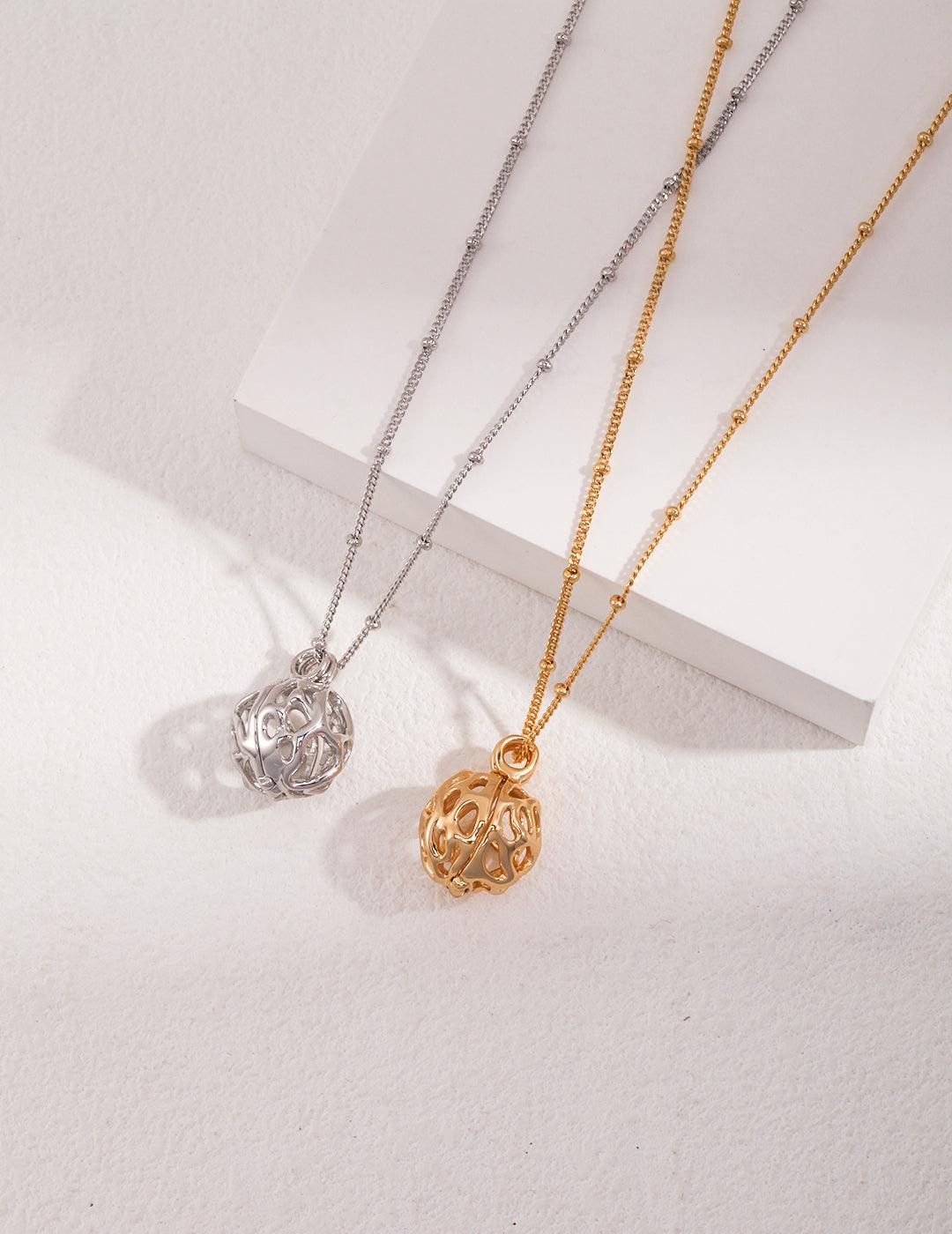 Beautifully crafted lantern-style pendant necklaces in gold and silver, perfect for timeless elegance