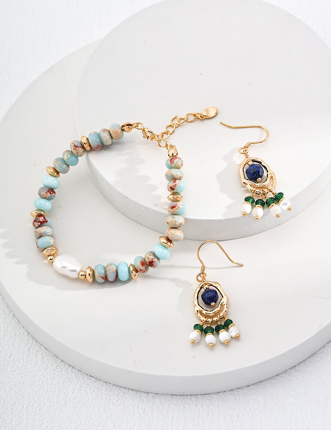 Elegant turquoise and gold beaded jewelry set featuring a delicate necklace and bracelet from Xaxa & Sie